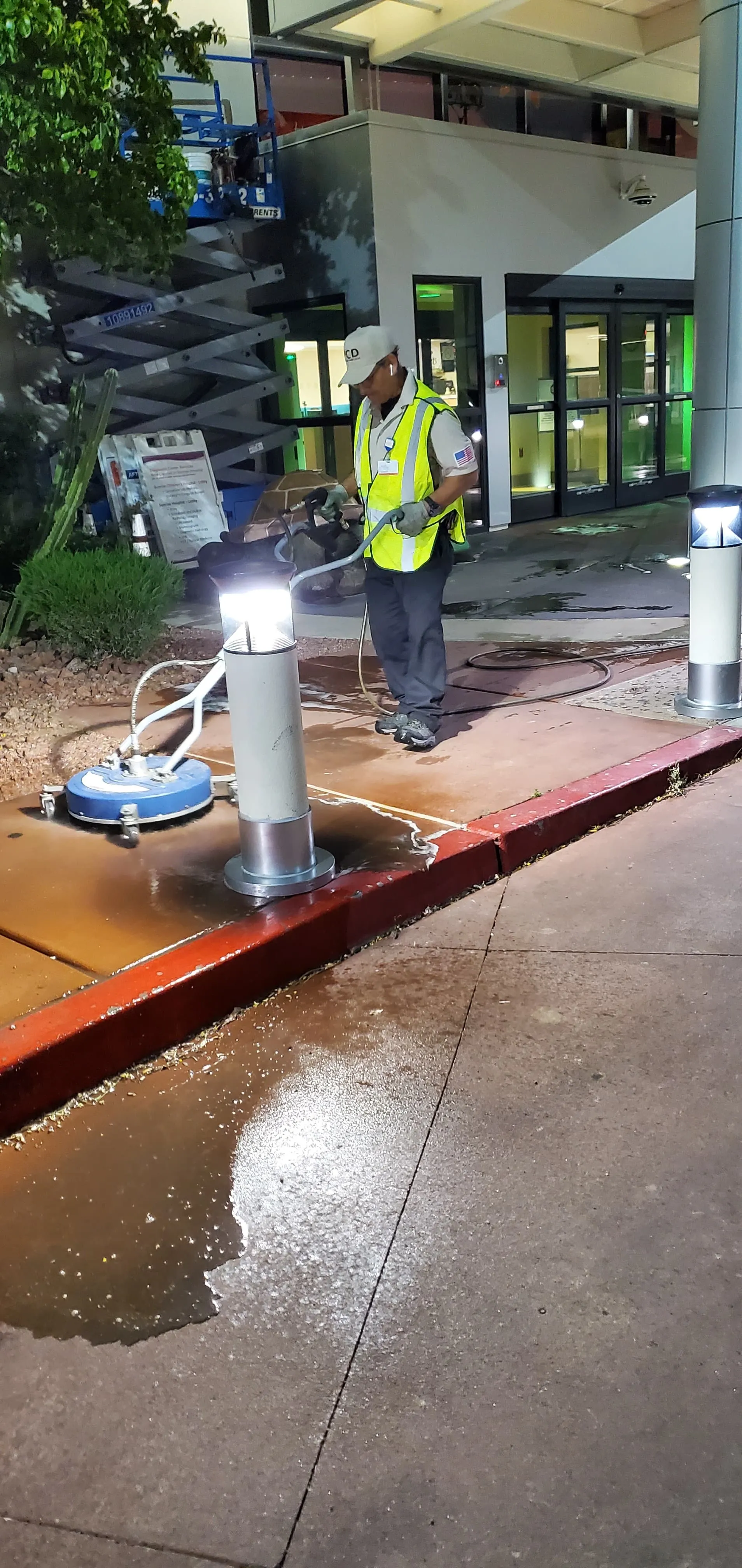 Pressure washing a sidewalk